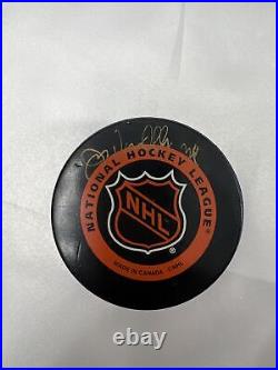 Hockey Puck collection set of 5 pucks autographed hockey puck Mike Eruzioe plus