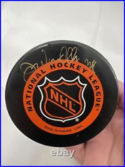 Hockey Puck collection set of 5 pucks autographed hockey puck Mike Eruzioe plus